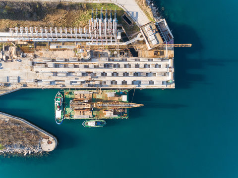 Aerial view of boats at the construction of future LNG terminal on the shore of the bay in Omisalj, Croatia