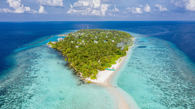 Aerial view of local island Omadhoo, located in Alif Dhaal Atoll, Maldives, Indian Ocean with reef, harbour, local beach, bikini / guest beach and sandbank