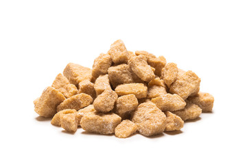 Brown sugar pieces isolated on white