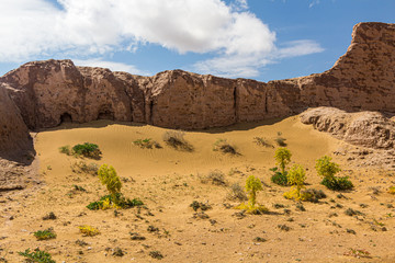 Eroded earthen walls of Ayaz Qala fortress in Kyzylkum desert, Uzbekistan