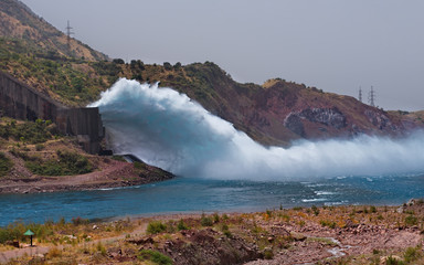Tajikistan, Spectacular discharge of excess water at the Nurek HPP on the Vakhsh river. The height of the dam is 300m (the highest in the world until 2013).