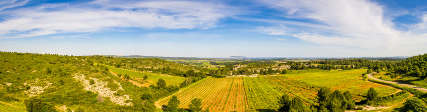Panorama of the countryside behind Valemagne and the port of Sète in the distance in the Hérault in Occitania, France