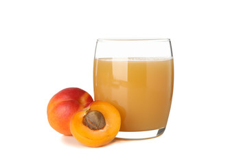 Glass with juice and apricots isolated on white background