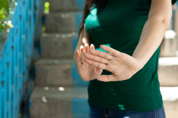 woman hand stop sign in street