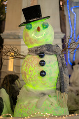 Decoration of a green snowman in a Christmas environment
