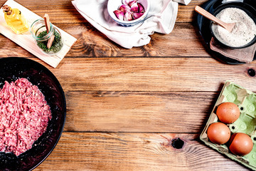 space to write recipe and ingredients for meatballs, on a wooden base.