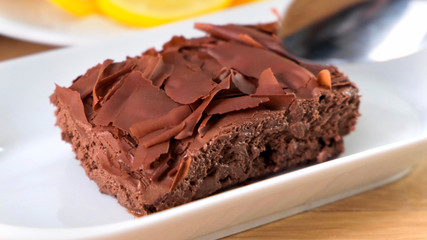 Chocolate tasty cake with spoon on table, close-up