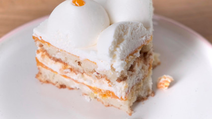 Person use the spoon for eat delicious cake with berry. Close up.