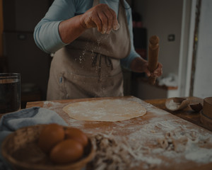 grandmother prepares fresh homemade pasta