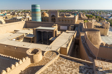Fortification walls with the West Gate and Kalta Minor minaret in the old town of Khiva, Uzbekistan.