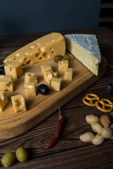 cheese variety with olives, herbs and pepper