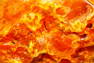 Modern luxury background. Sun stone texture. Patterns of different colors in amber macro photography. Ancient fossil resin. Inclusions in amber. Sun stone. Beautiful natural patterns. Copal