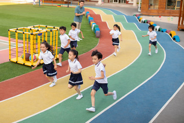 Children running on sports track