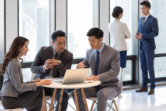 Successful business people talking in office