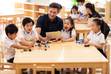 Children learning coding in classroom