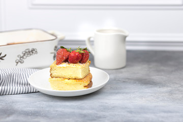 cottage cheese casserole with strawberries on a white plate
