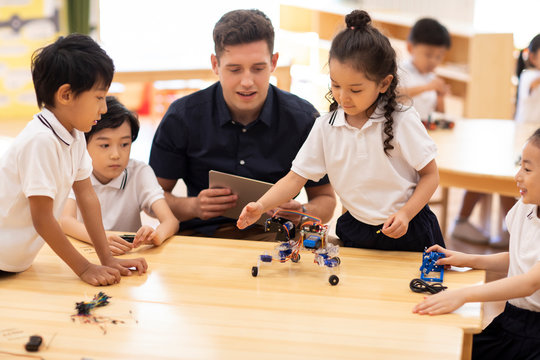 Children learning coding in classroom