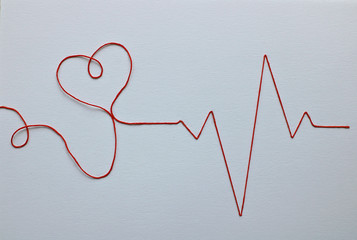 Pulse of man and heart in the form of applique on paper