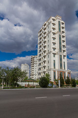 Fototapeta na wymiar Marble-clad buildings of modern Ashgabat, Turkmenistan