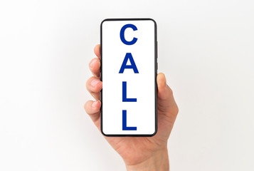 CALL inscription word text on white screen of a phone in a male hand isolated on white background