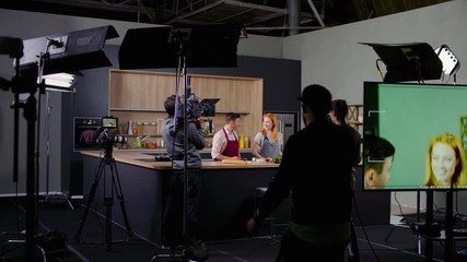 WIDE Behind the scenes of studio set, shooting TV television cooking show featuring celebrity chef, professional TV production. Shot on ARRI Alexa Mini