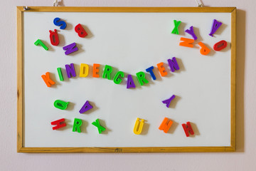 “Kindergarten” concept: Colorful letters and the word “Kindergarten”