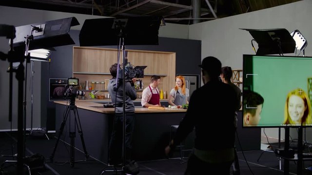 WIDE Behind the scenes of studio set, shooting TV television cooking show featuring celebrity chef, professional TV production. Shot on ARRI Alexa Mini