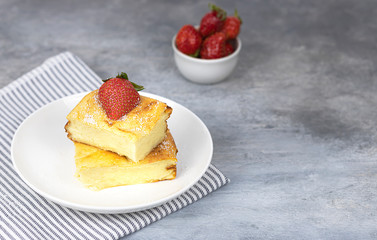 cottage cheese casserole with strawberries on a white plate