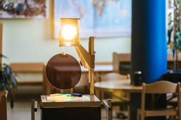 Schooling concept: Retro overhead projector in classroom, educational system