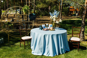 The guest table is decorated with flowers.