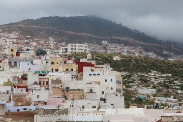View of the colorful old buildings of Tetouan Medina quarter in Northern Morocco. A medina is...