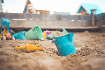 Childhood sandbox concept: Close up of plastic toy bucket © Patrick Daxenbichler
