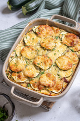 casserole with cheese and zucchini in baking dish