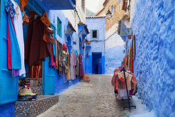 Obraz na płótnie Canvas View of the walls with souvenirs in Medina in Chefchaouen, Morocco. The city is noted for its buildings in shades of blue and that makes Chefchaouen very attractive to visitors.