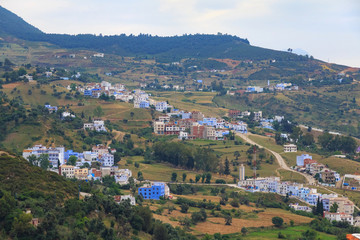 Fototapeta na wymiar View of the suburbs of Chefchaouen, Morocco. The city, also known as Chaouen is noted for its buildings in shades of blue and that makes Chefchaouen very attractive to visitors.