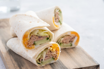 Tuna melt wrap with egg, cucumber and salad