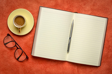 blank notebook or journal with coffee
