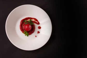 The fresh tomato with young herbs. A dish of fresh vegetables.