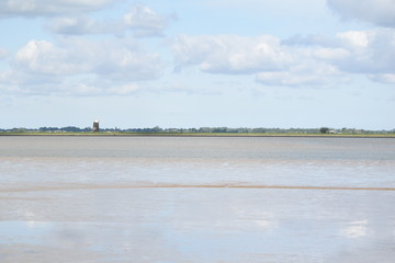 Cloudy skies over Breydon Water, a stretch of the River Yare in Great Yarmouth, Norfolk, UK.