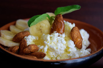 Fresh cottage cheese with fruit, nuts and honey.Healthy diet.