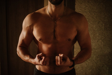 strong, healthy, athletic man shows his result after exercise and healthy eating