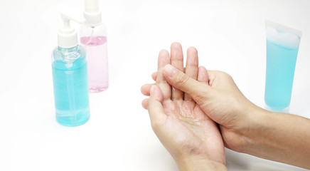 Woman cleaning hands with alcohol gel.Women using bottle of antibacterial sanitiser soap.