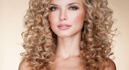 Beautiful blonde woman. Healthy Long Blond Hair. Curly Hair. Blond. Permed Hair. Afro curls. Long blond Hair.  Beauty Model Girl with Luxurious Hair. - obrazy, fototapety, plakaty