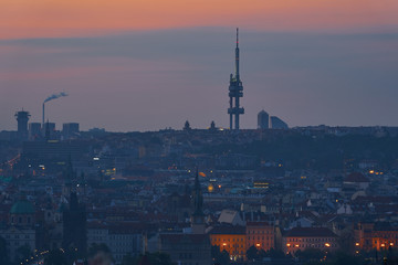 Panoramatic Picture of the Prague, capitol of Czech republic in Europe before sunrise in blue hour, show mix of historic and modern architecture with tallest prague building, Zizkov television tower.