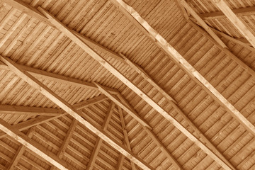 The construction of the wooden roof. Detailed photo of a wooden roof overlap construction.