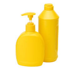 Two Yellow bottles with dishwashing liquid isolated on a white background