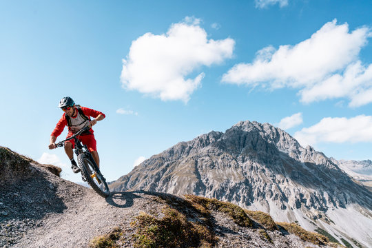 Man riding on mountainbike, Munestertal Valley, Grisons, Switzerland