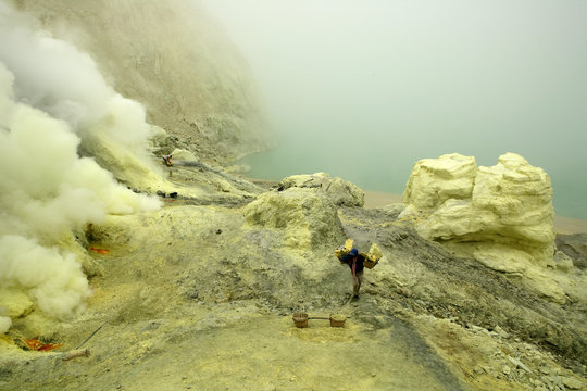 Indonesia, Java, Sulphur miners working in the crater at Kawah Ijen