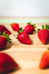 Juicy ripe strawberries. Bunch of berries on a wood table top background. Delicious and healthy fruit in summer.