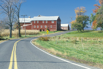 Fototapeta na wymiar A red barn and scenic route 9G in the Hudson River Valley, NY